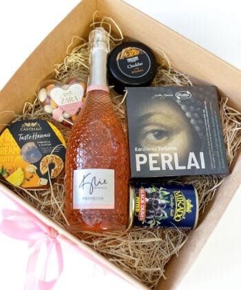A box with sweets and the bottle of prosecco