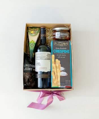 A box with red wine and delicious snacks